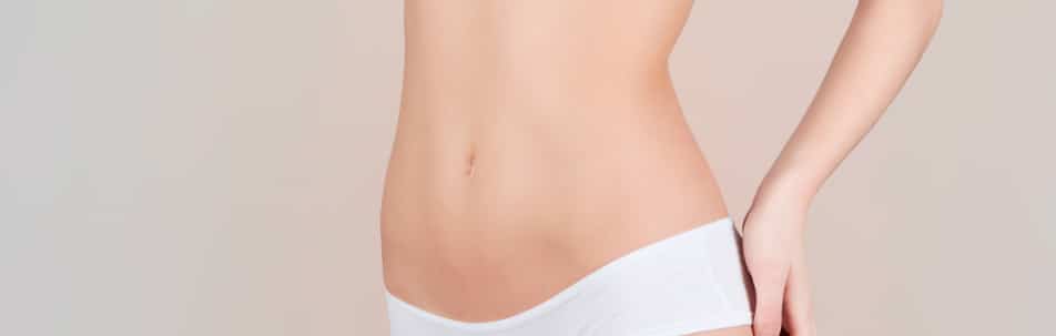 Stock photograph of a model's midriff in white underwear
